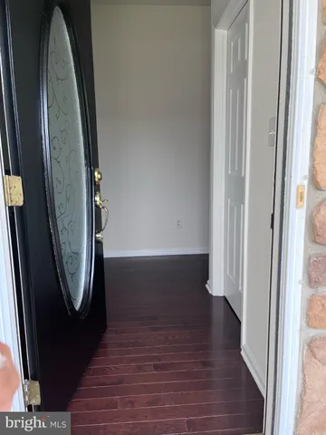 an entryway with wooden floor