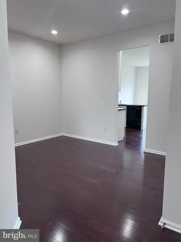 a view of room with hardwood floor