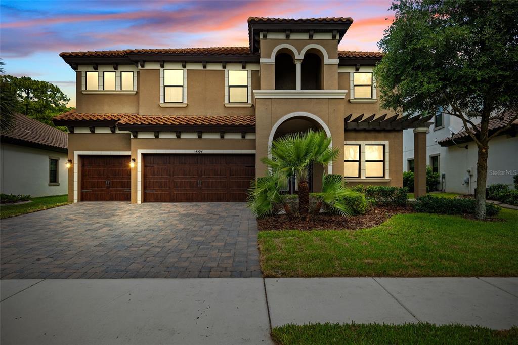4594 Night Star Trail Odessa, FL 33556 - Photo 1 of 1 a front view of a house with garden