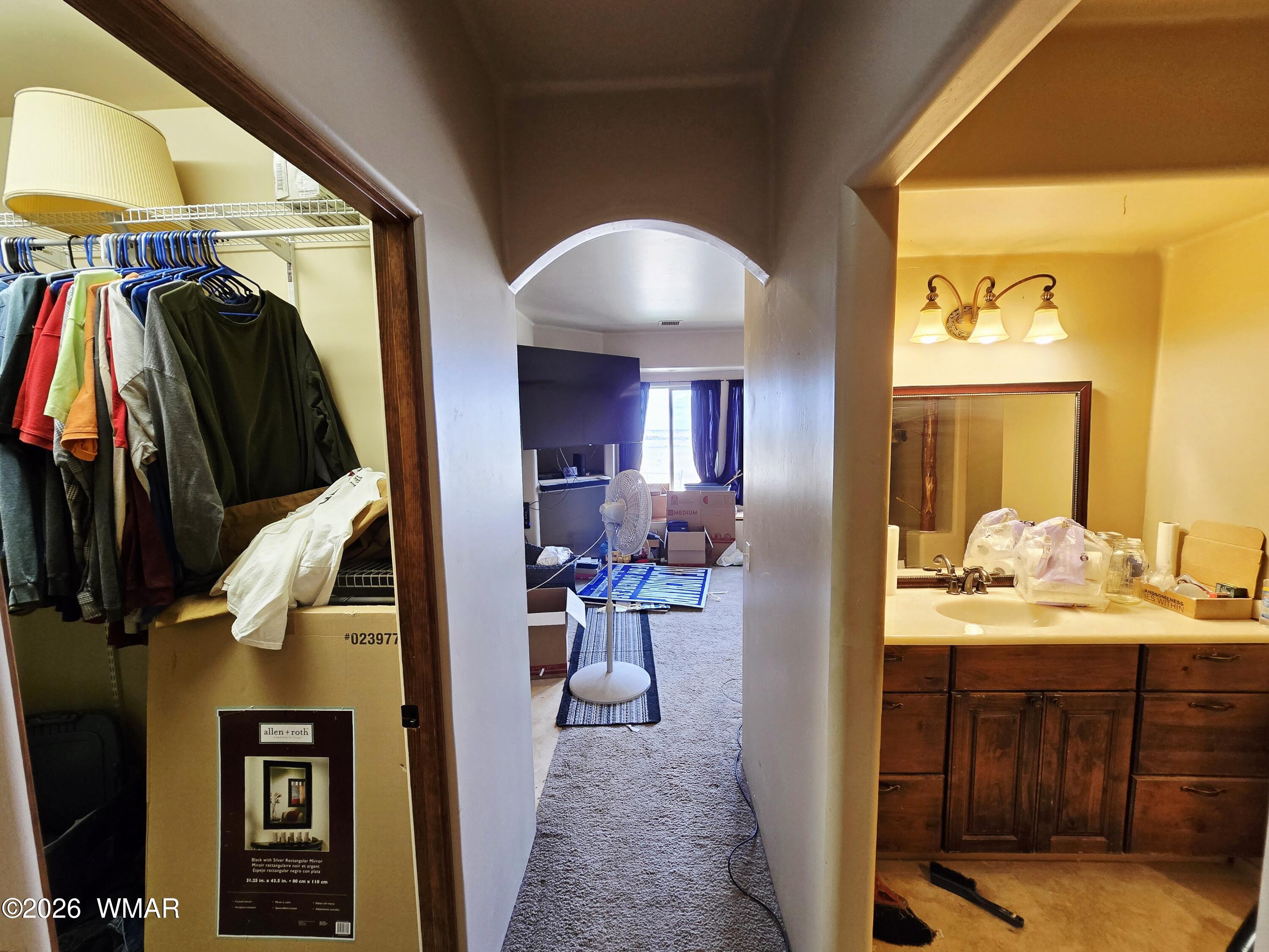 9046 Miller Trail Snowflake, AZ 85937 - Photo 13 of 34 a view of walk in closet with clothes and shoes