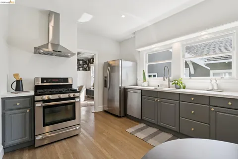 a kitchen with a sink stove and refrigerator