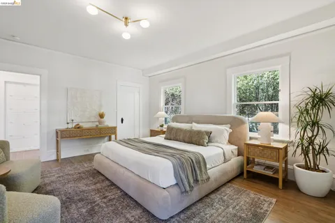 a spacious bedroom with a bed and a couch