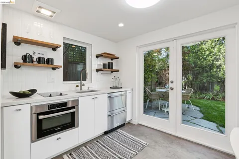 a kitchen with a stove and a sink