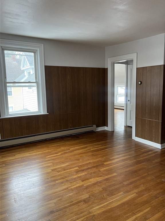 134 Bay State Road, Unit 2 Rehoboth, MA 02769 - Photo 15 of 18 an empty room with wooden floor and windows