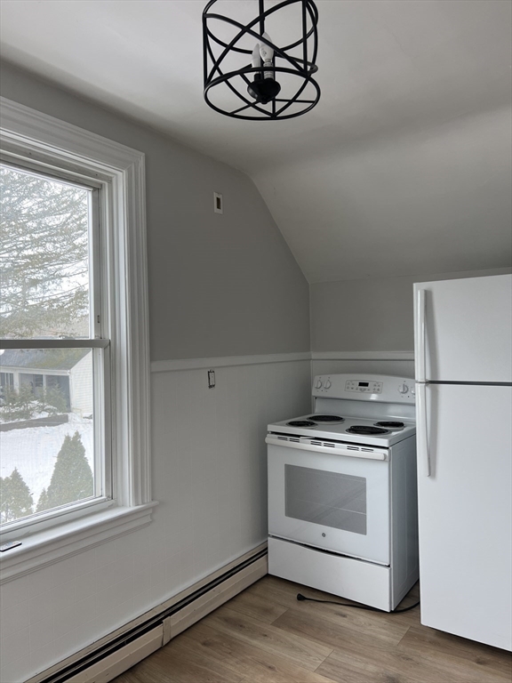 134 Bay State Road, Unit 2 Rehoboth, MA 02769 - Photo 2 of 18 a stove top oven sitting inside of a kitchen