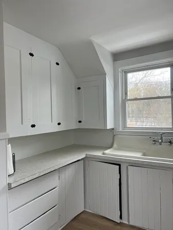 a view of cabinets and window