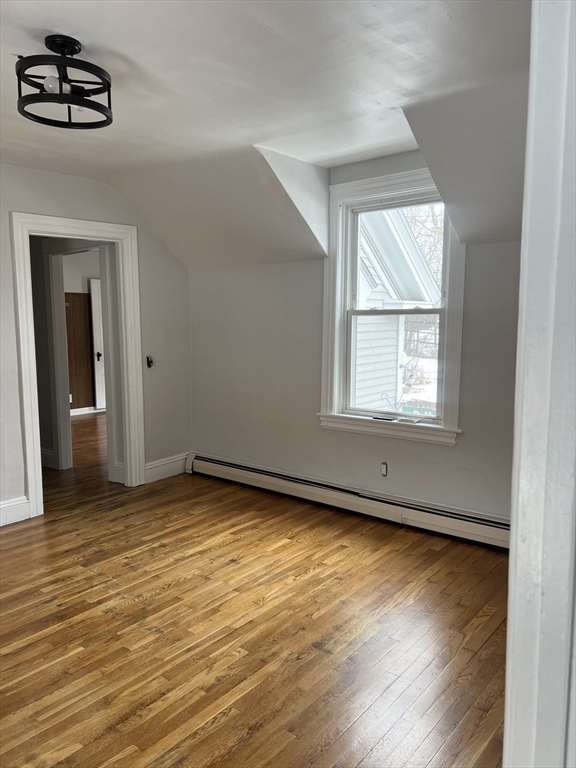 134 Bay State Road, Unit 2 Rehoboth, MA 02769 - Photo 5 of 18 an empty room with wooden floor and windows