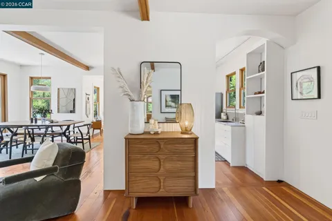 a spacious bathroom with a tub sink and mirror