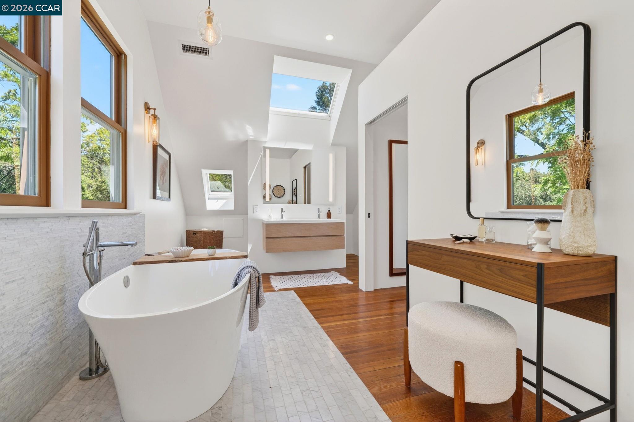4009 Redwood Road Napa, CA 94558 - Photo 56 of 91 a spacious bathroom with a tub sink and mirror