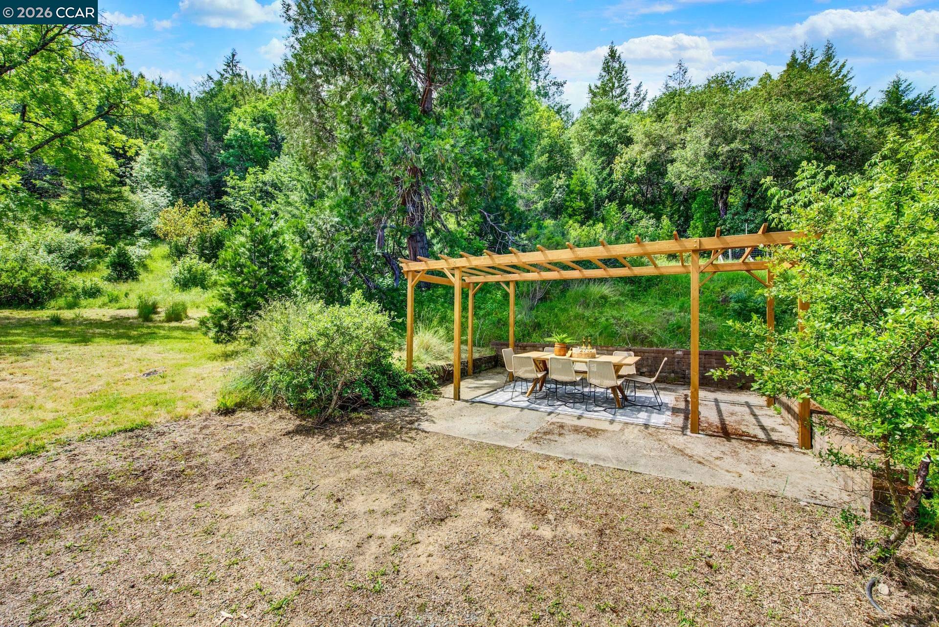 4009 Redwood Road Napa, CA 94558 - Photo 79 of 91 a view of a house with backyard sitting area and garden