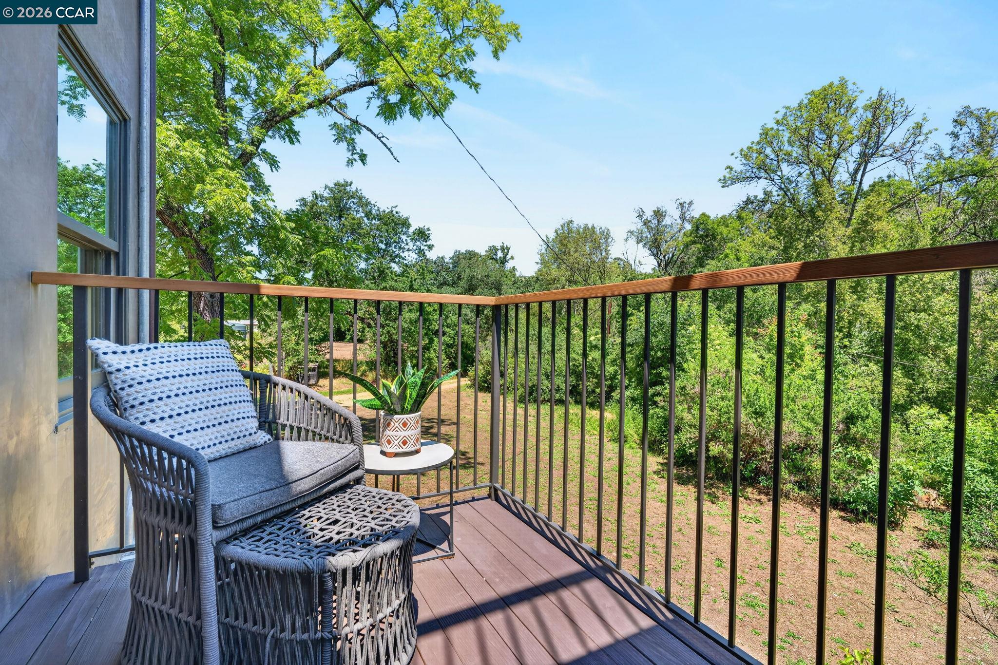 4009 Redwood Road Napa, CA 94558 - Photo 85 of 91 a view of a balcony with wooden floor and outdoor seating