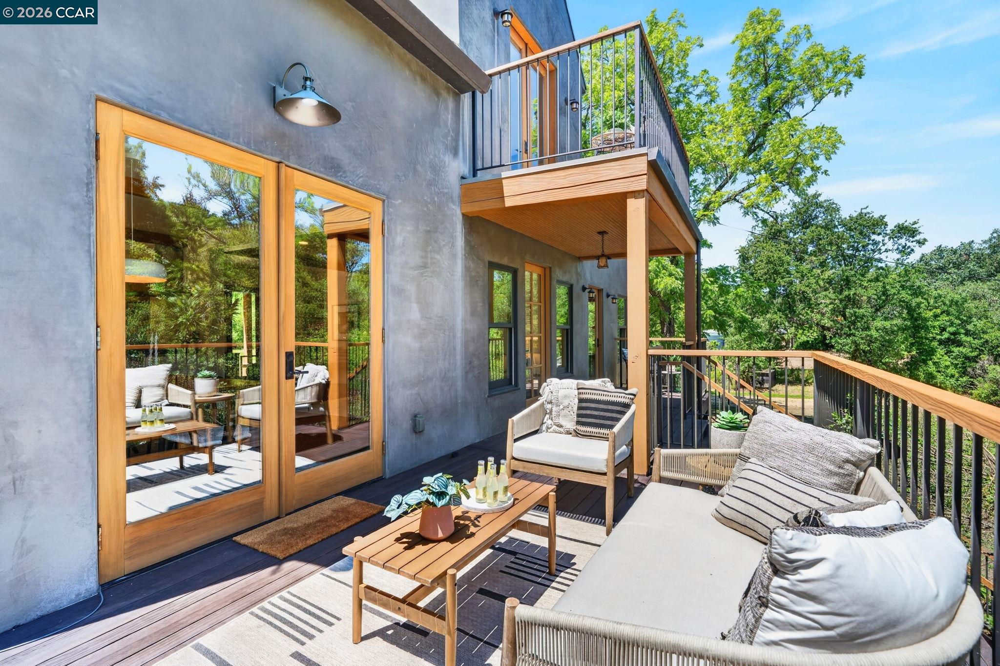 4009 Redwood Road Napa, CA 94558 - Photo 87 of 91 a view of a patio with couches table and chairs and potted plants