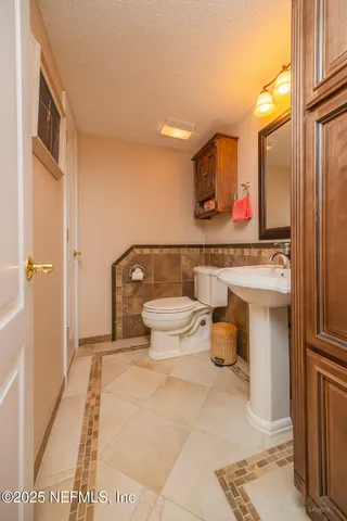 a view of a room with table and chairs