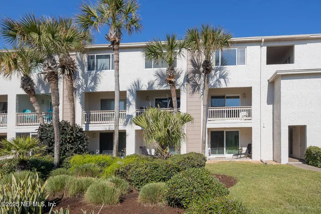 a view of a swimming pool with outdoor seating