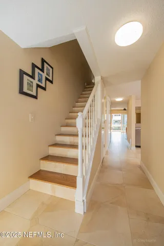 a kitchen with stainless steel appliances a refrigerator sink and microwave
