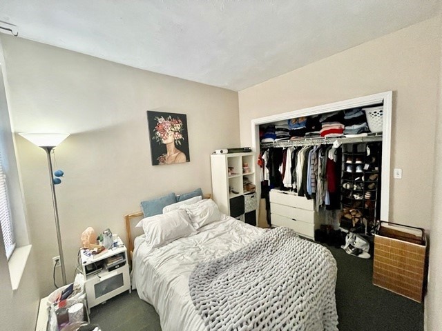 17 Thacher Street, Unit 3 Boston, MA 02113 - Photo 20 of 24 a bedroom with a bed and walk in closet