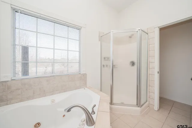 a bedroom with a bed dresser and a window