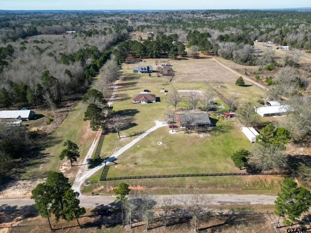 an aerial view of a house with outdoor space