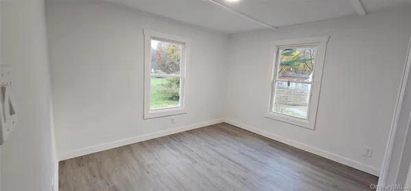 a bathroom with a toilet and a shower curtain