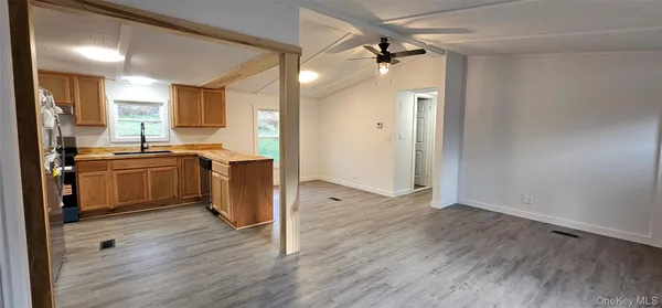 a kitchen with a sink stove and cabinets