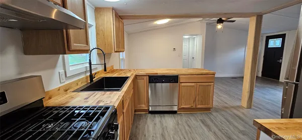 a kitchen with a refrigerator sink and stove