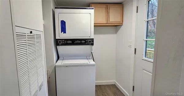 a kitchen view of a stove and wooden floor