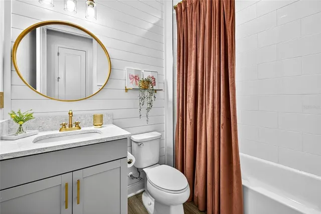 a view of a bathroom with a sink and mirror