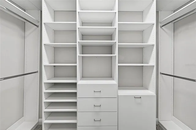 a view of an empty room with a balcony