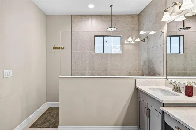 a view of a house with a big yard and large tree