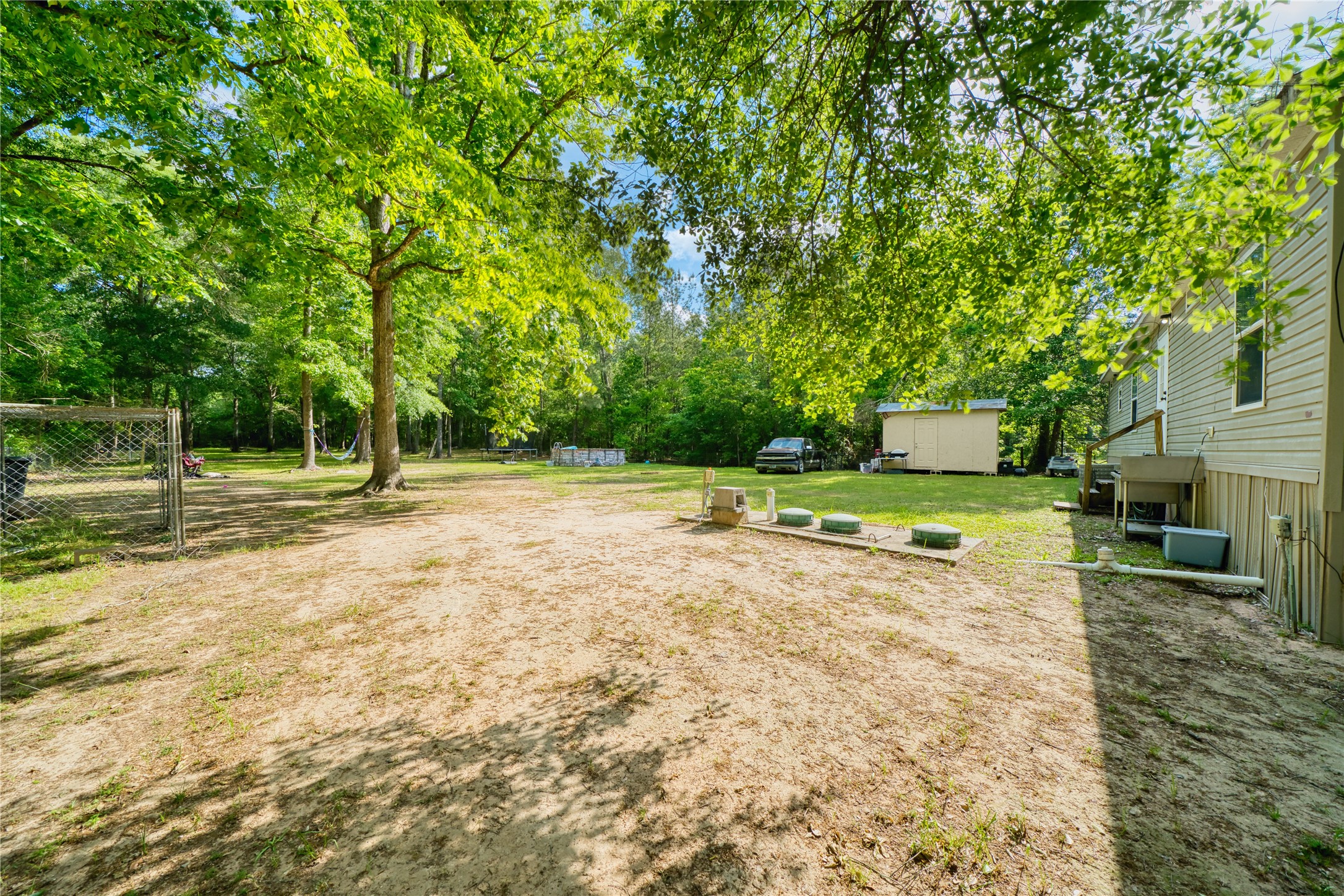 103 County Road 370 Splendora, TX 77372 - Photo 28 of 32 a view of a basketball area with green space