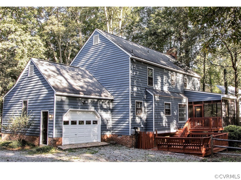 13301 Queensgate Road Midlothian, VA 23114 - Photo 2 of 20 a view of a house with a patio and wooden fence