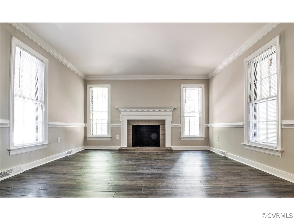 13301 Queensgate Road Midlothian, VA 23114 - Photo 9 of 20 a view of empty room with wooden floor and fireplace