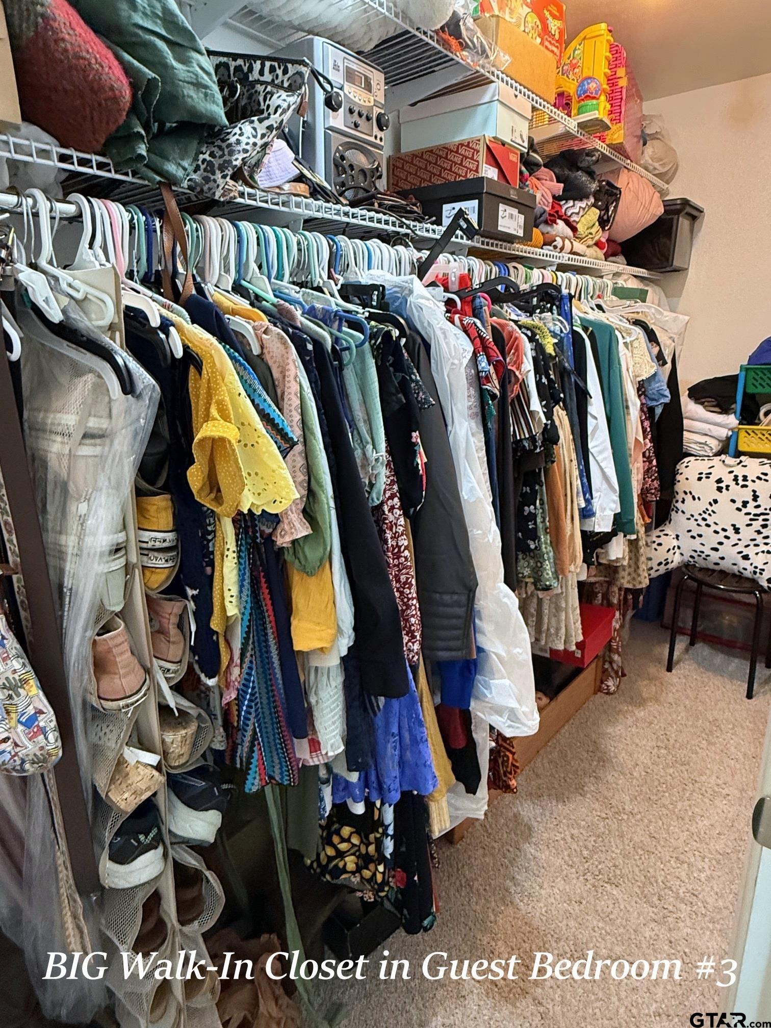 237 Oregon Street Van, TX 75790 - Photo 23 of 44 a view of walk in closet with clothes and shoes