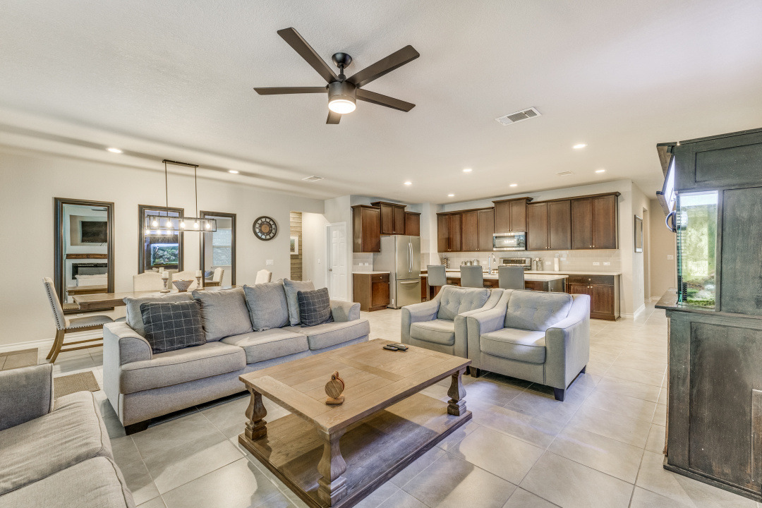 5921 Lehman Way Austin, TX 78747 - Photo 6 of 25 An open concept living area seamlessly connects the kitchen and dining spaces, perfect for entertaining.