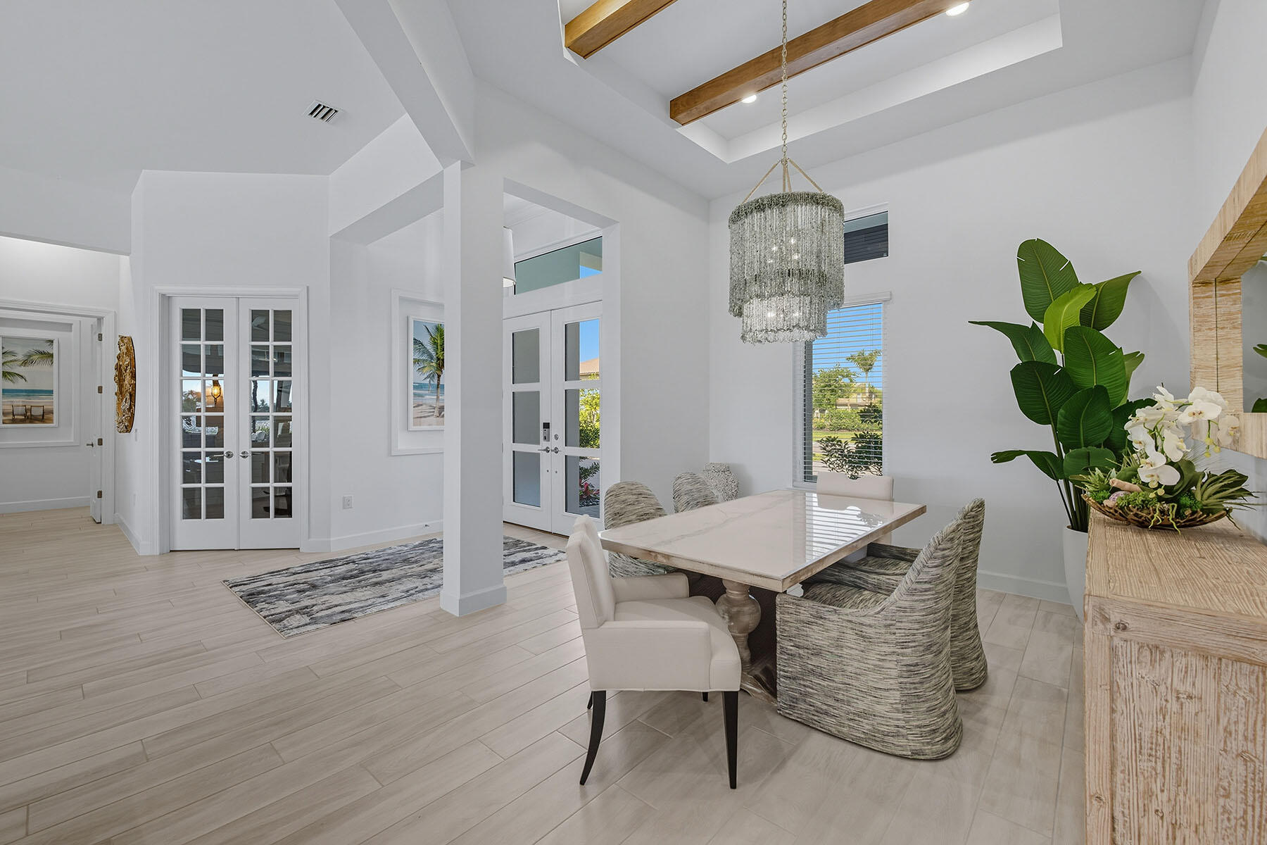 15326 Turin Drive Naples, FL 34114 - Photo 12 of 50 a view of a dining room with furniture window and wooden floor