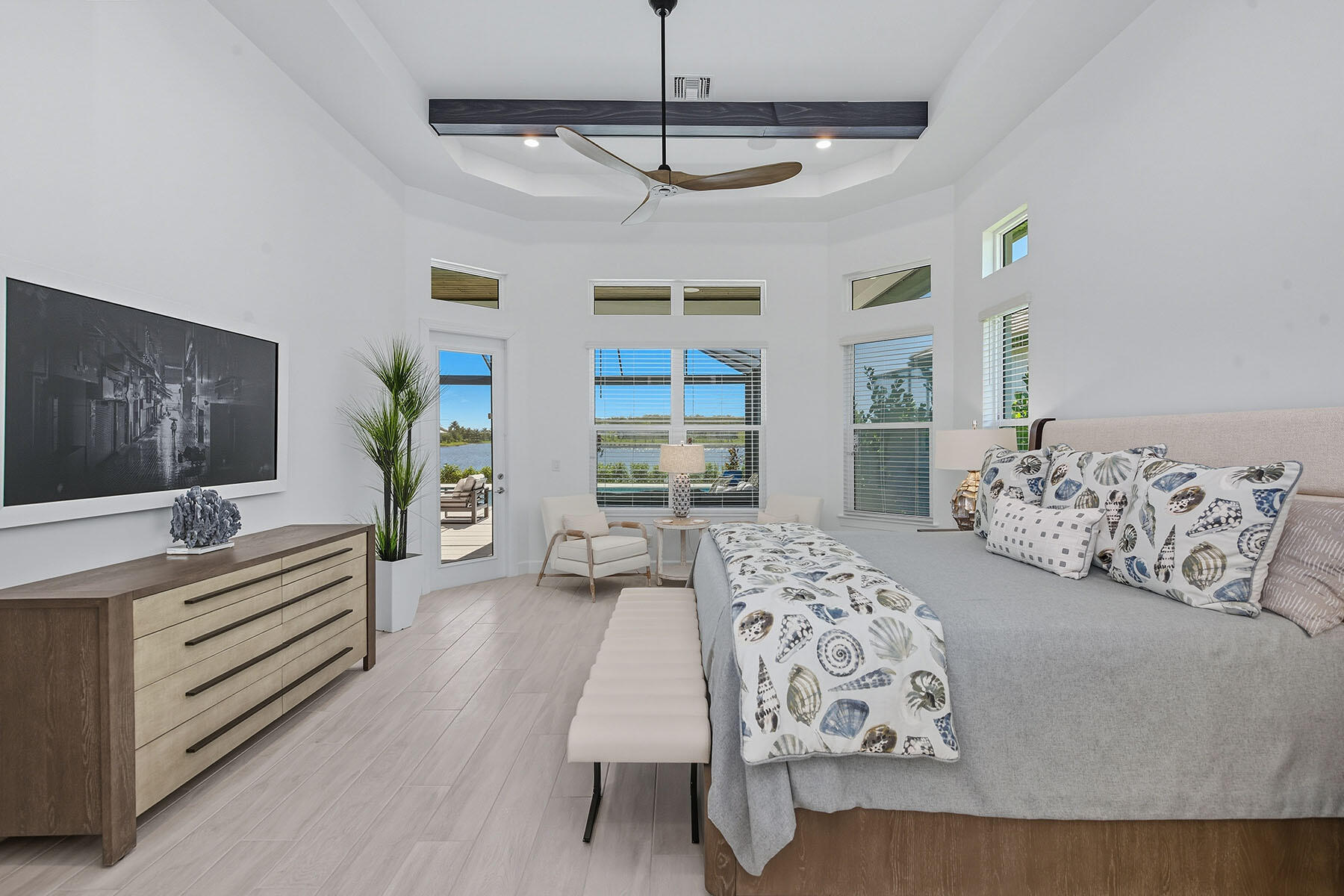 15326 Turin Drive Naples, FL 34114 - Photo 13 of 50 a spacious bedroom with a large bed and a chandelier