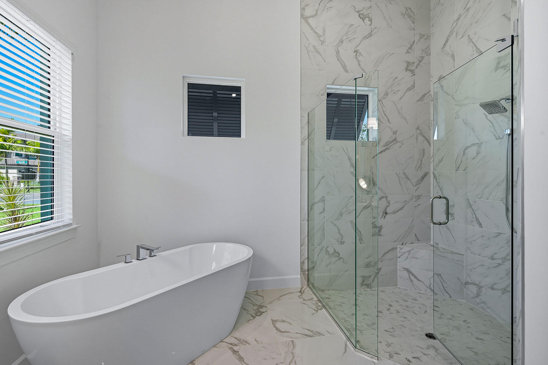 15326 Turin Drive Naples, FL 34114 - Photo 15 of 50 a bathroom with a bathtub and shower