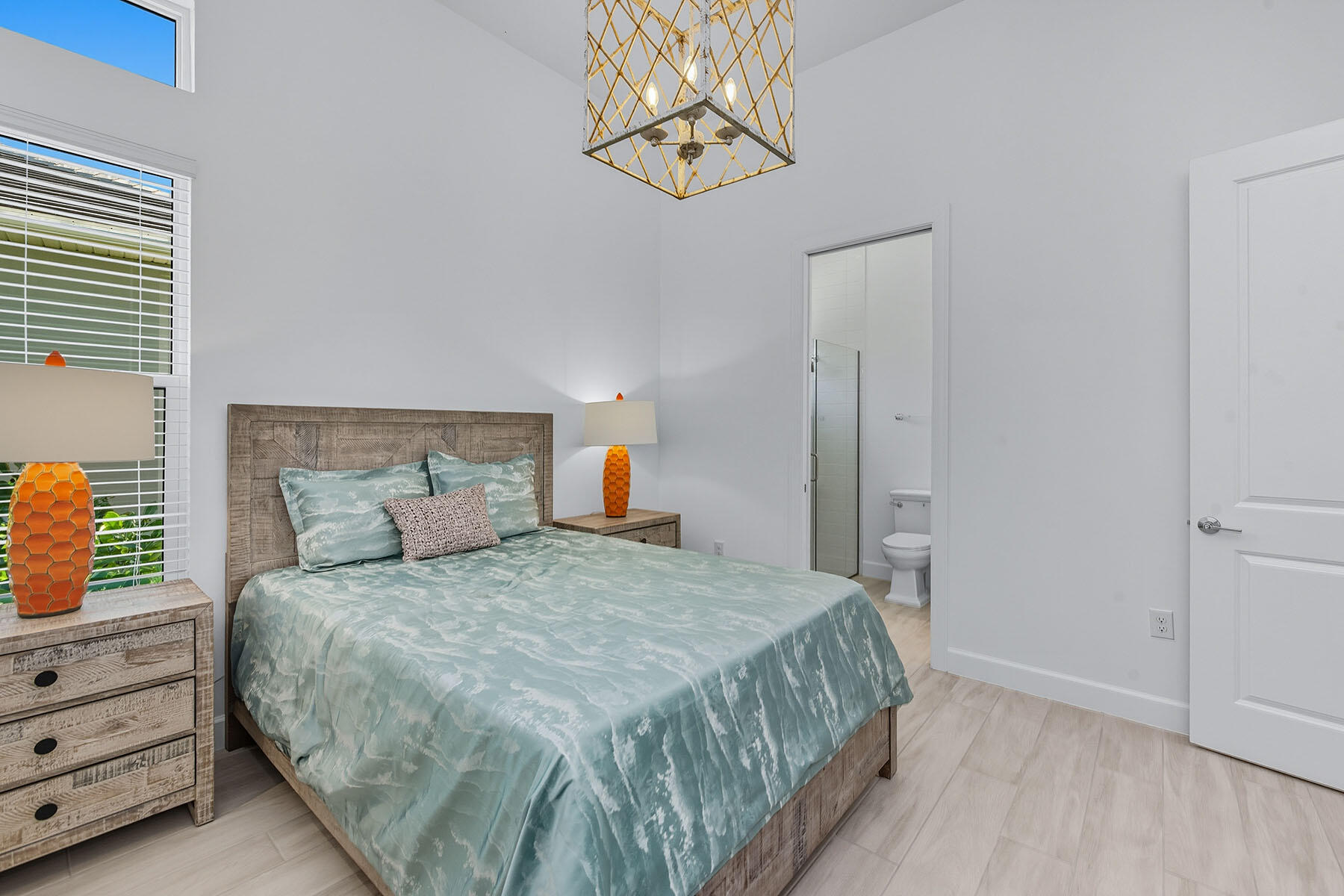 15326 Turin Drive Naples, FL 34114 - Photo 18 of 50 a bedroom with a bed and a window