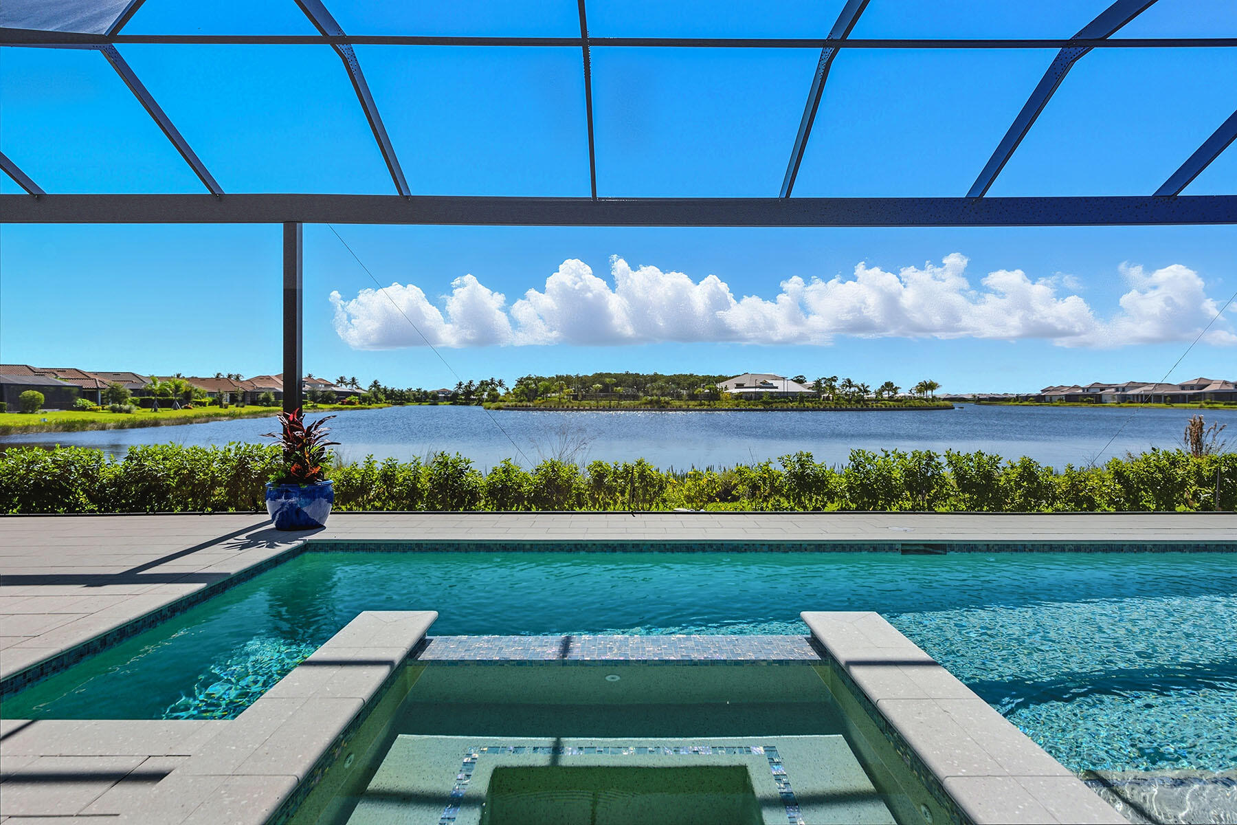 15326 Turin Drive Naples, FL 34114 - Photo 2 of 50 a view of a city street view with a lake view