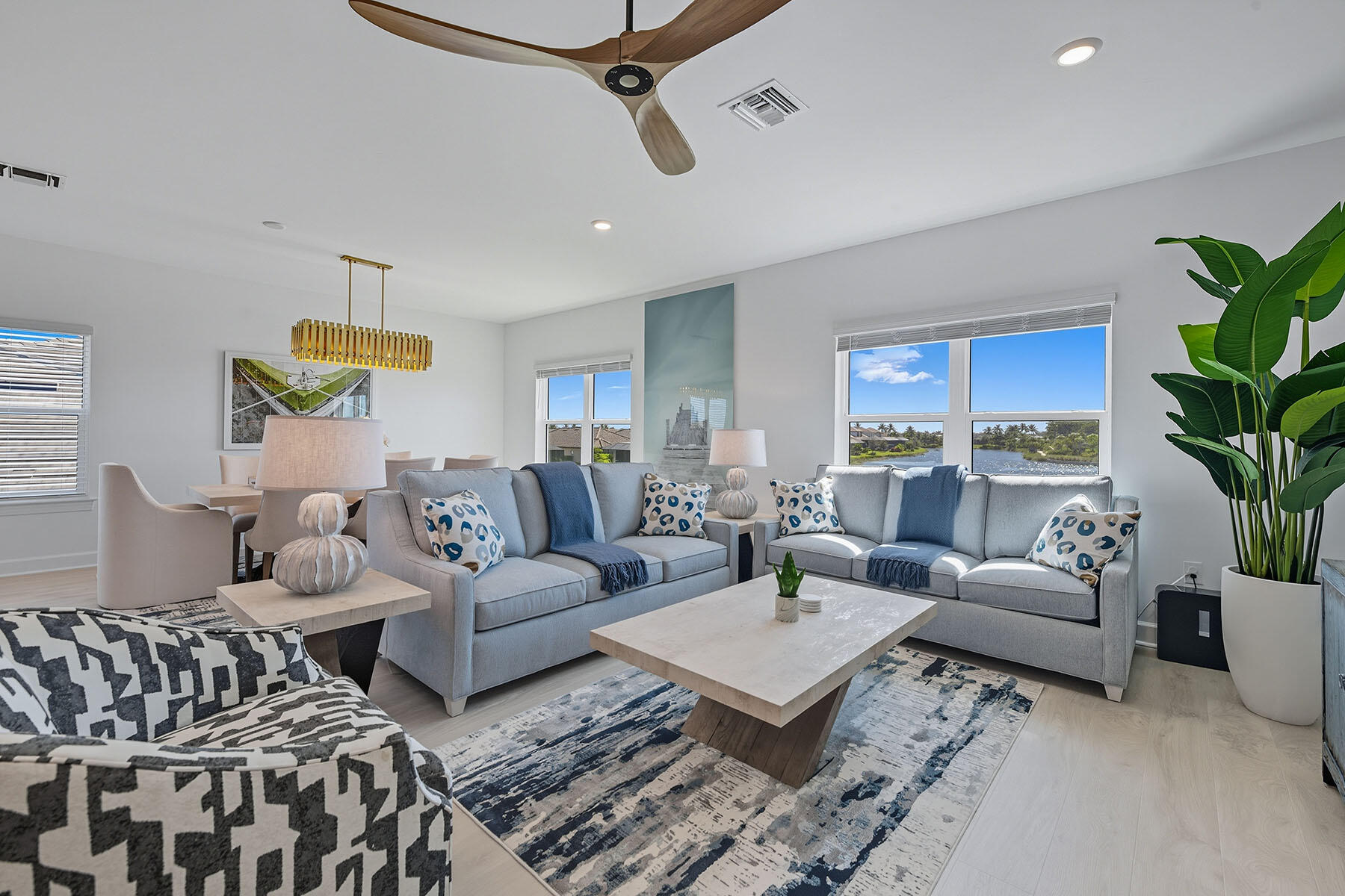 15326 Turin Drive Naples, FL 34114 - Photo 21 of 50 a living room with furniture and a potted plant
