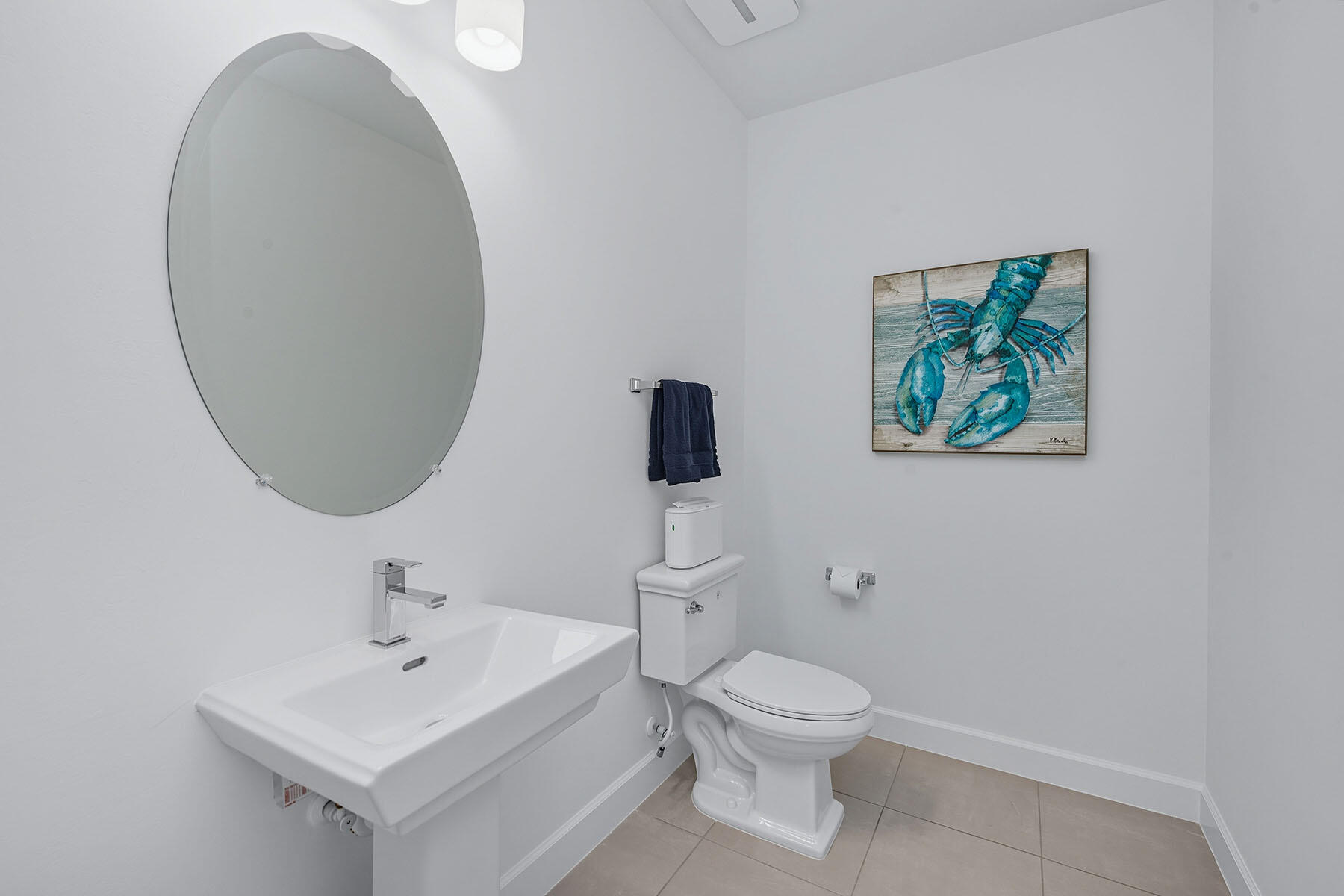 15326 Turin Drive Naples, FL 34114 - Photo 24 of 50 a bathroom with a toilet a sink and mirror