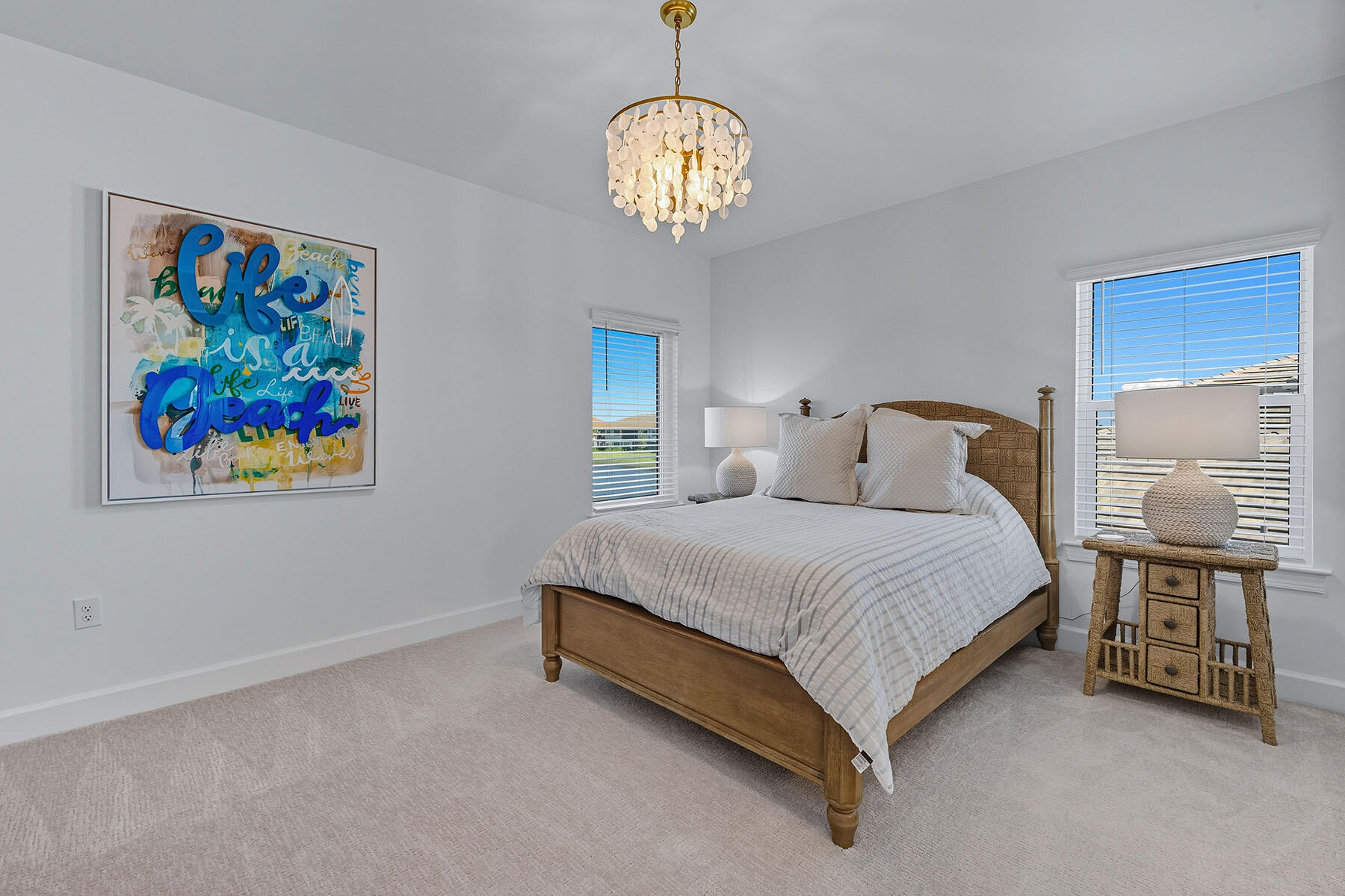 15326 Turin Drive Naples, FL 34114 - Photo 25 of 50 a bedroom with a bed and a chandelier