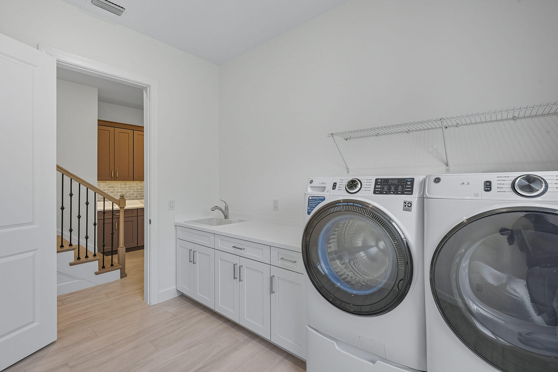 15326 Turin Drive Naples, FL 34114 - Photo 29 of 50 a utility room with sink dryer and washer
