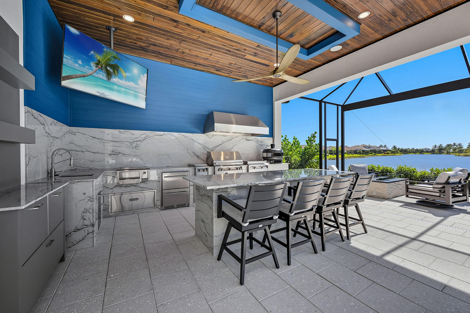 15326 Turin Drive Naples, FL 34114 - Photo 30 of 50 a kitchen with a table chairs and a stove