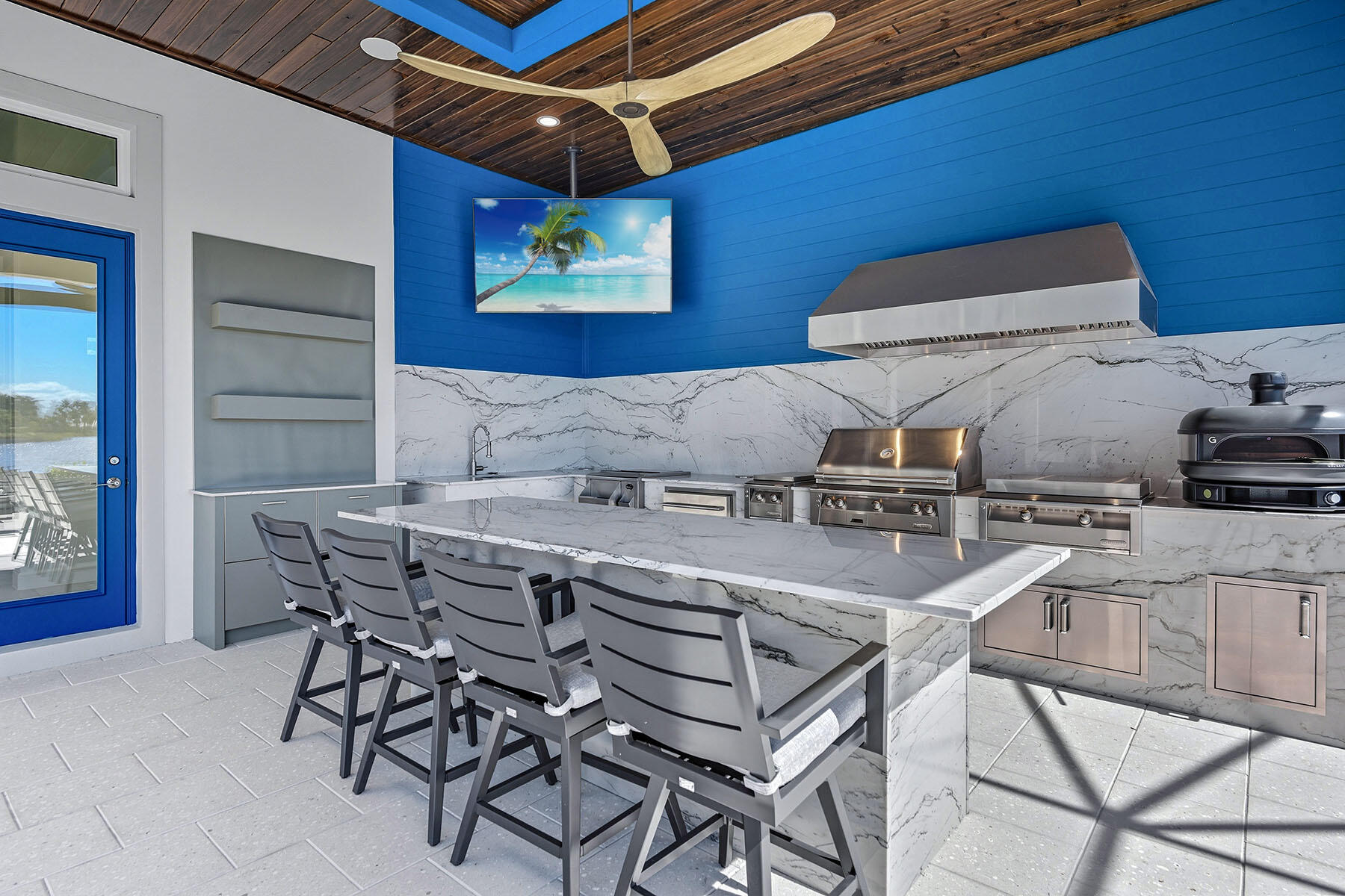 15326 Turin Drive Naples, FL 34114 - Photo 31 of 50 a kitchen with a stove a sink and a table with chairs