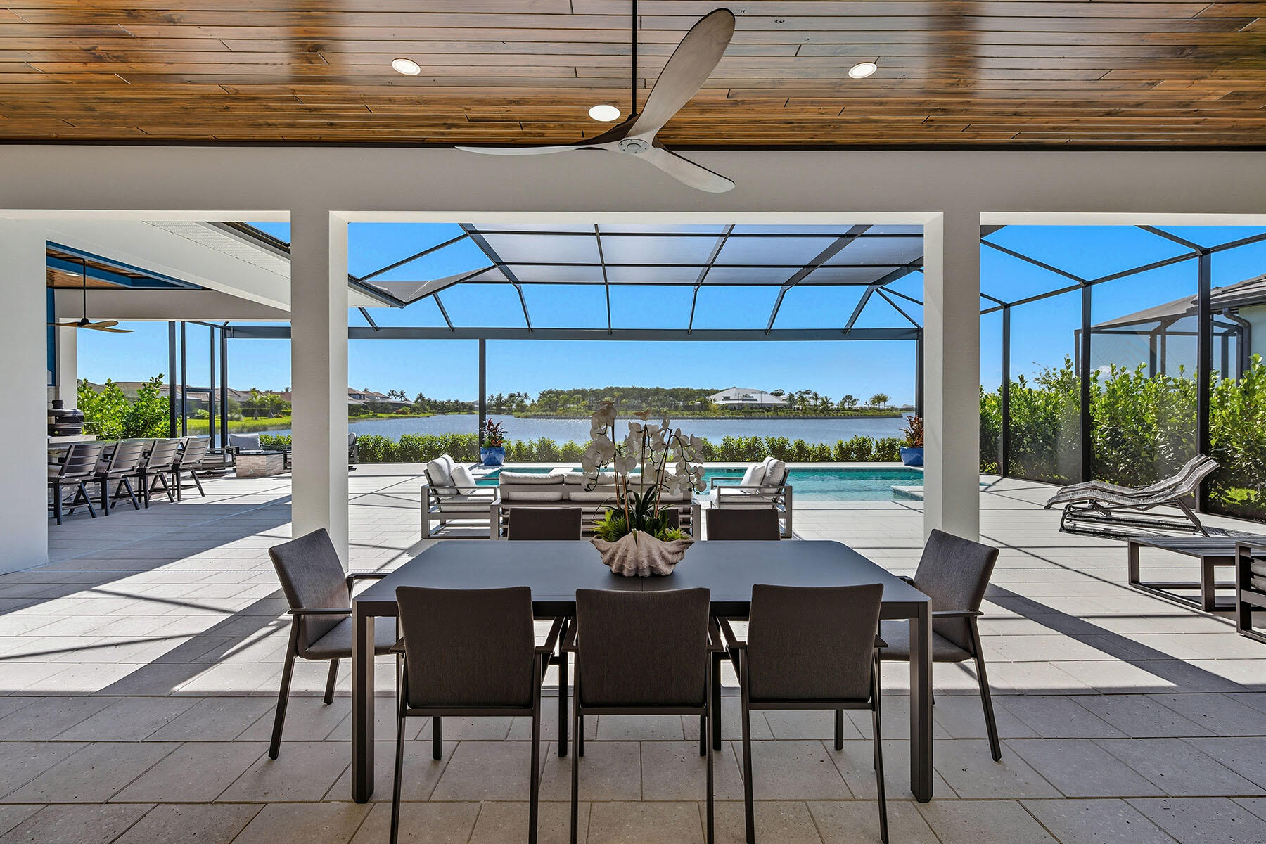 15326 Turin Drive Naples, FL 34114 - Photo 33 of 50 a view of a dining room with furniture window and outside view