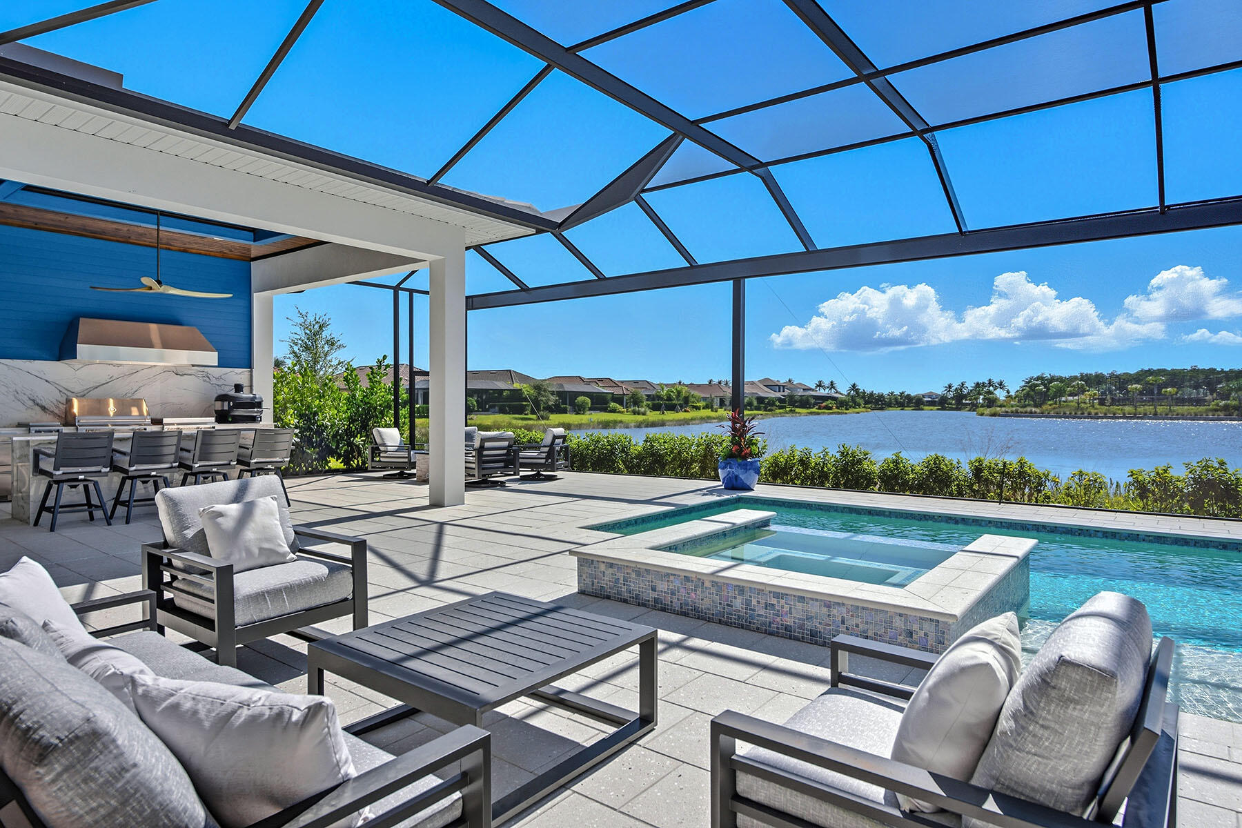 15326 Turin Drive Naples, FL 34114 - Photo 36 of 50 a view of swimming pool with outdoor seating and a yard