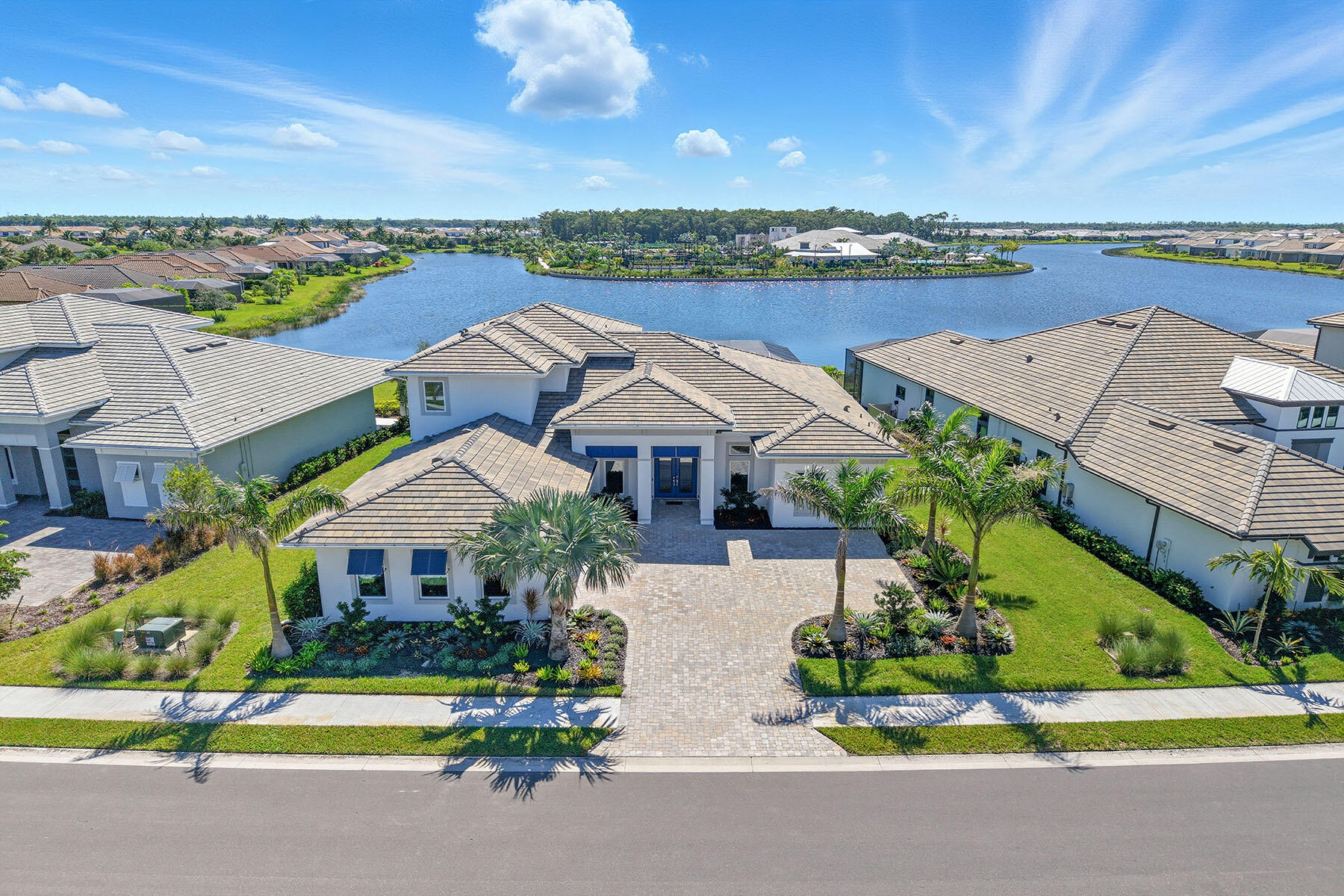 15326 Turin Drive Naples, FL 34114 - Photo 39 of 50 an aerial view of a house with a garden and a car park in front of the house