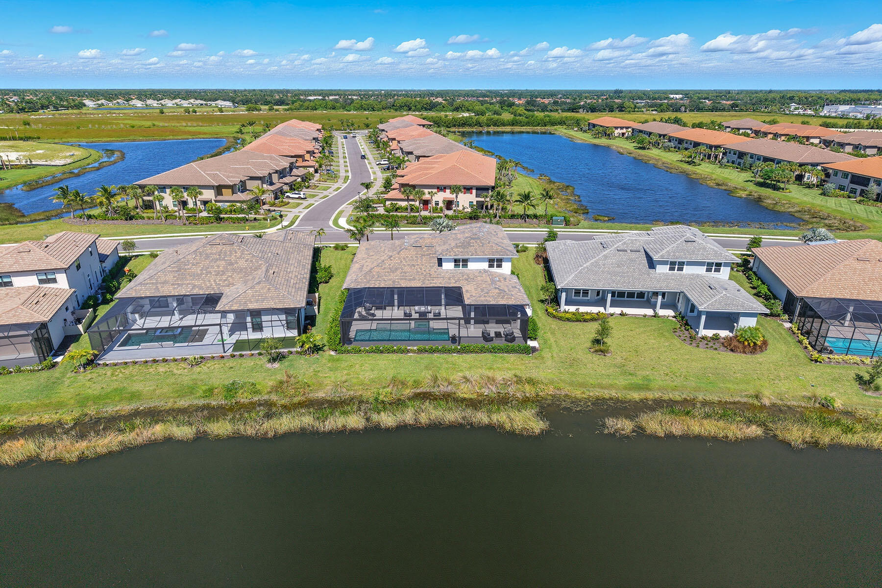 15326 Turin Drive Naples, FL 34114 - Photo 41 of 50 an aerial view of residential houses with outdoor space and ocean view