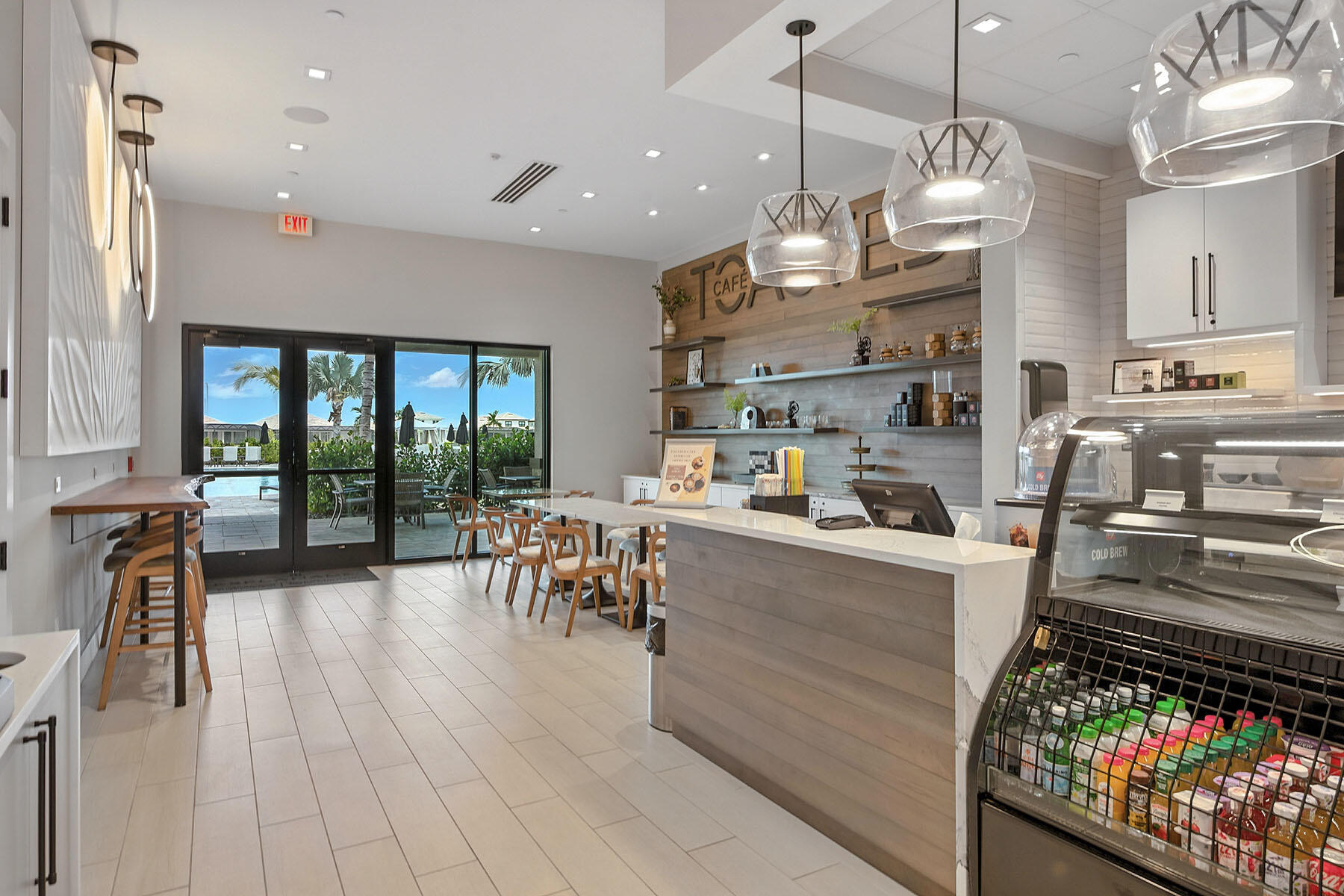 15326 Turin Drive Naples, FL 34114 - Photo 47 of 50 a kitchen with stainless steel appliances granite countertop a stove top oven a dining table and chairs with wooden floor